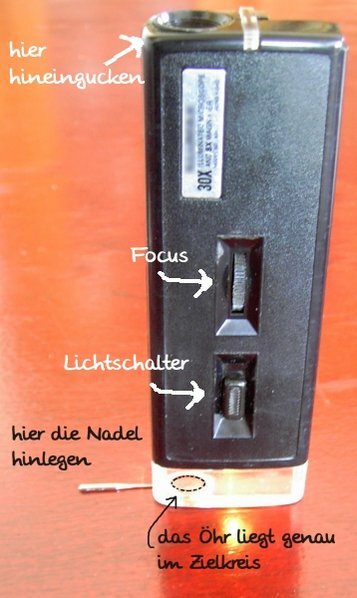 nadel mit lupe