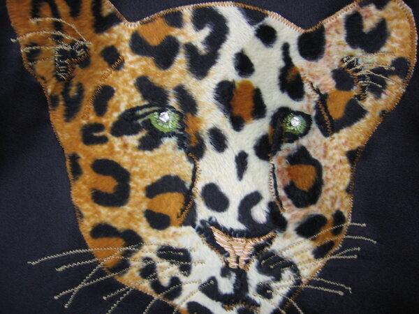 Leopardenkopf-Applikation
