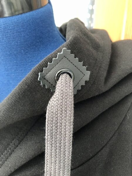 Ösenverstärkung mit kleinem Lederstück